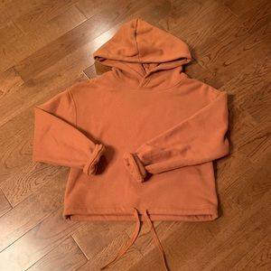Garage hoodie with ties at the bottom